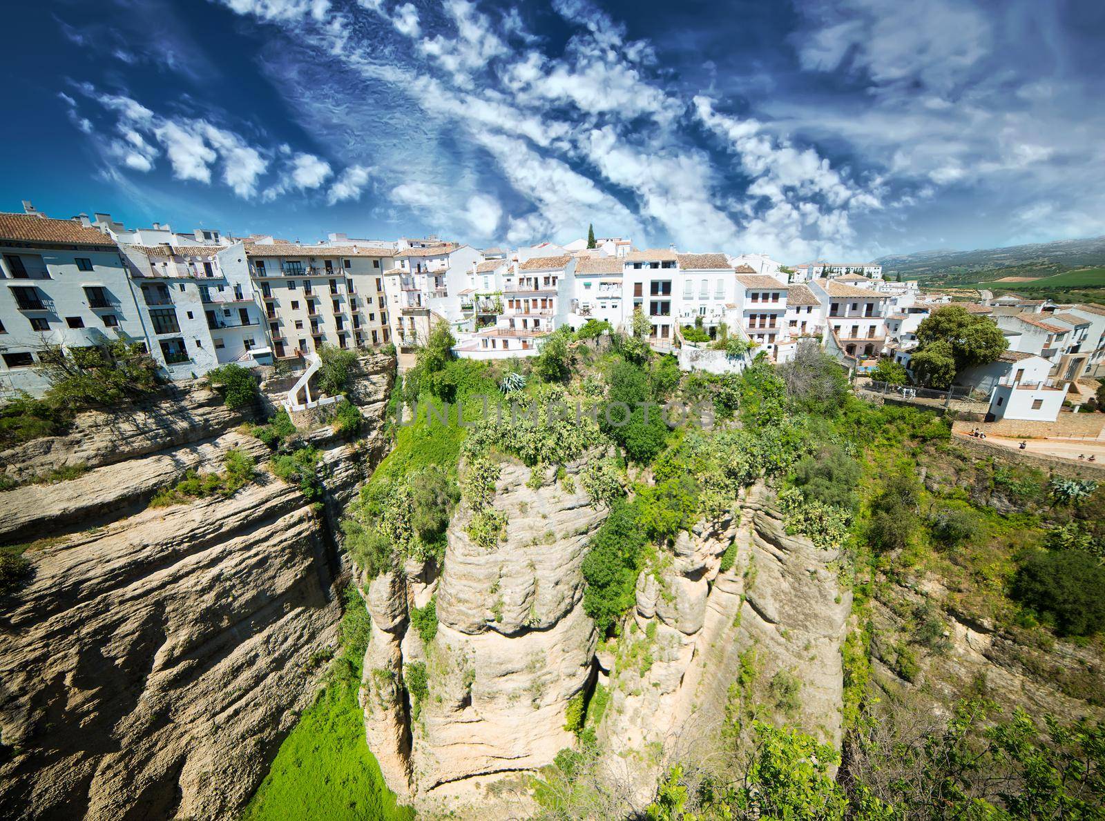 Panoramic view from New bridge in Ronda against sky in Andalucia, Spain