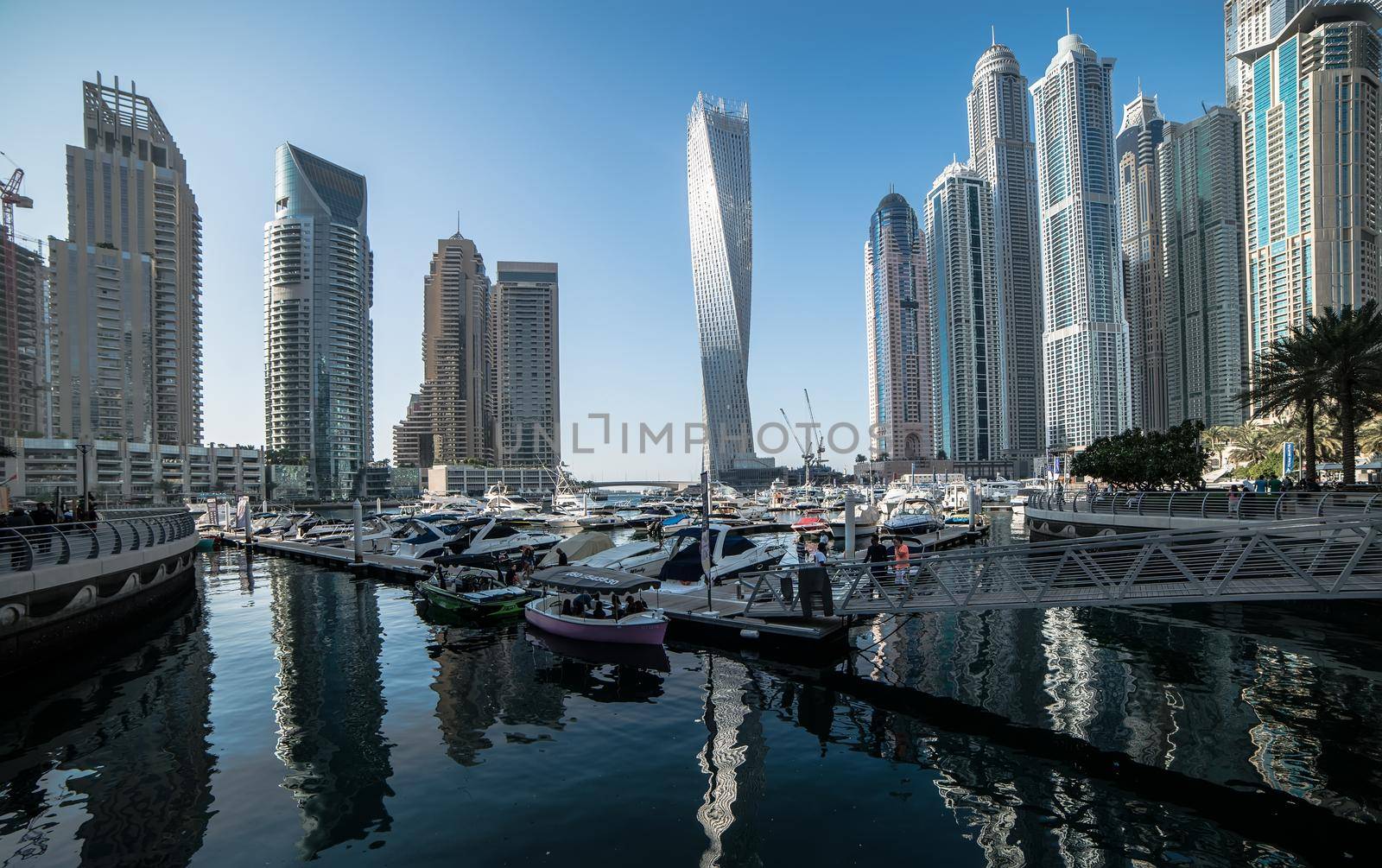 Dubai, United Arab Emirates - December 14, 2013: Panoramic view with modern skyscrapers and water channel of Dubai Marina, United Arab Emirates
