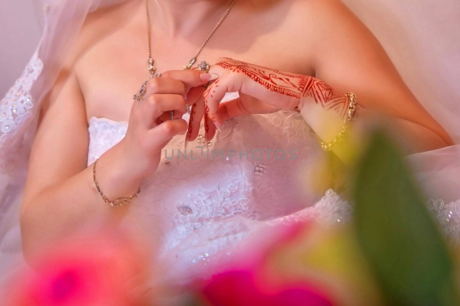 The bride wears a ring on her own hands . Closeup wedding rings on the hands by Adil_Celebiyev_Stok_Photo