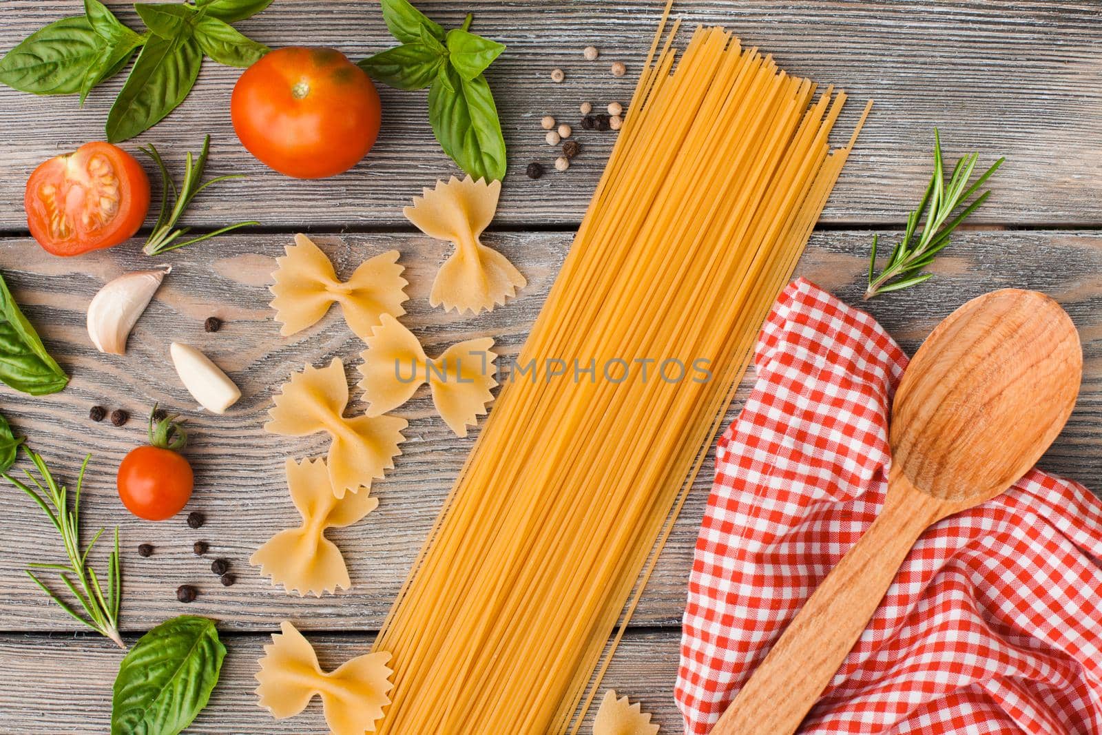 Raw Italian pasta with tomato sauce ingredients