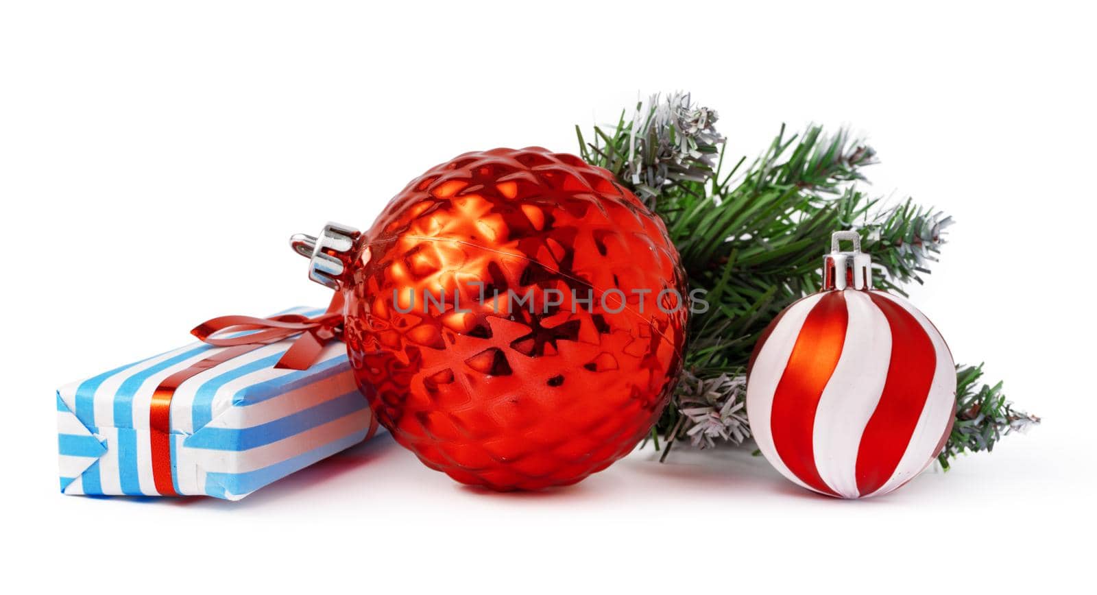 Christmas baubles and festive gift box isolated on white background by Fabrikasimf