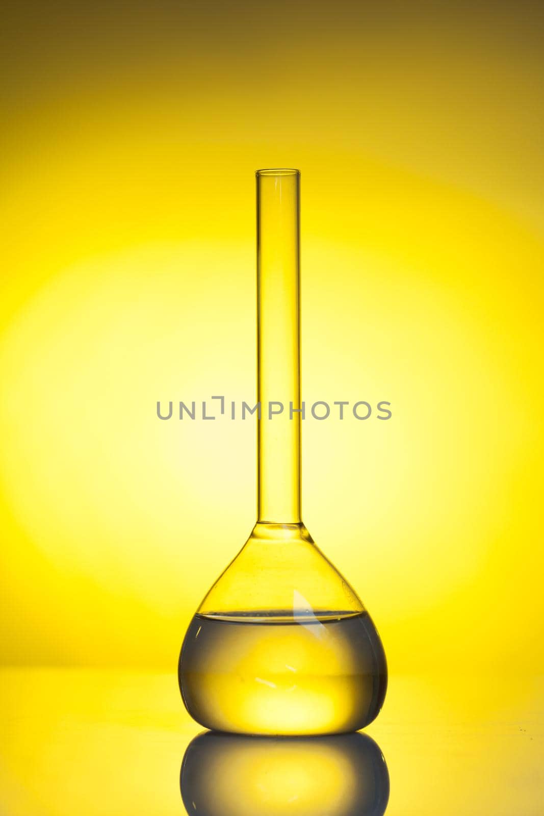 The flat-bottomed flask with transparent liquid - laboratory glass