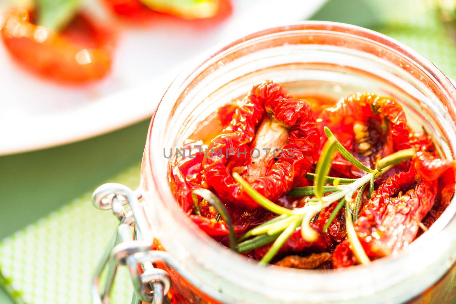 sun dried tomatoes in a glass jar