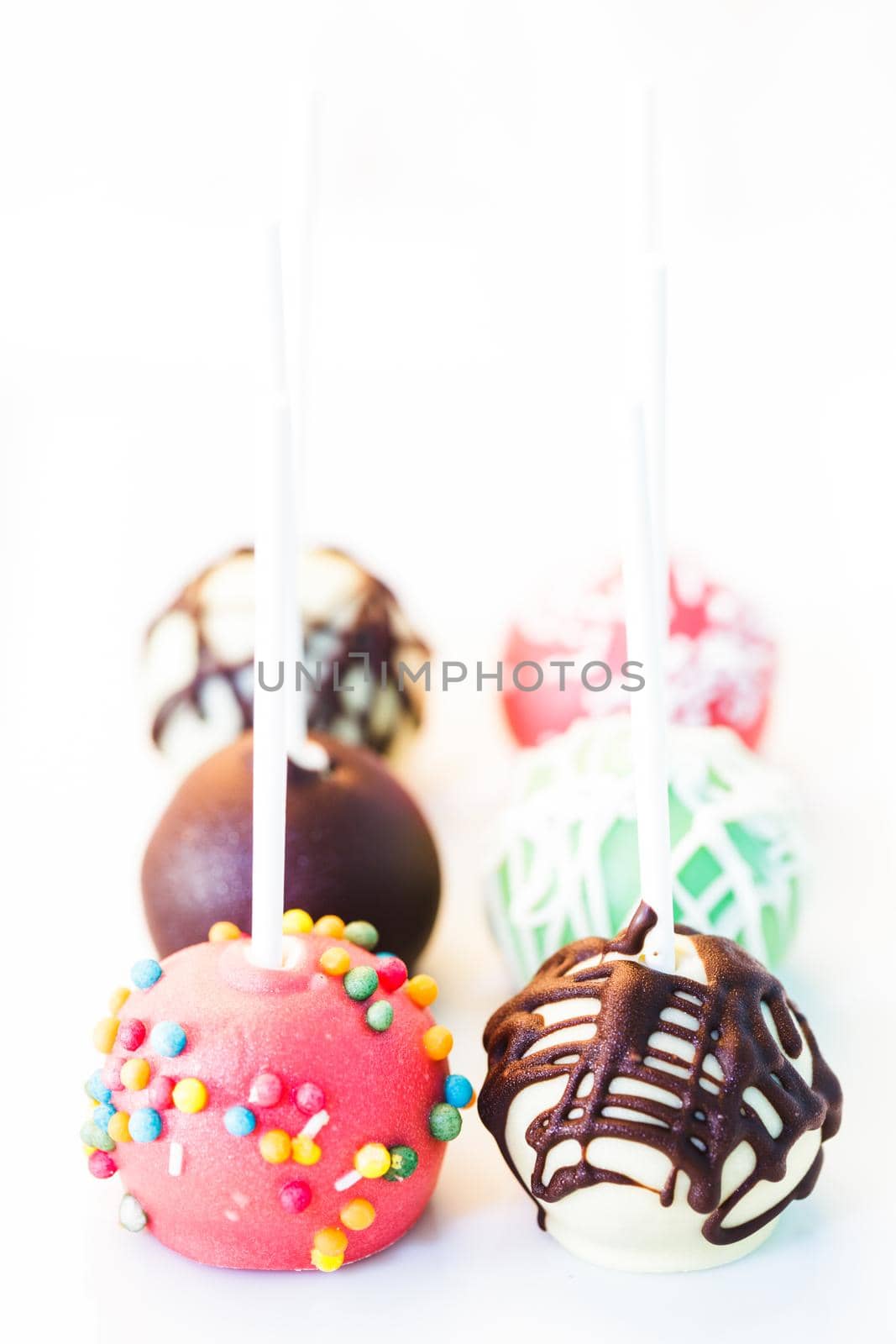 Cake pops close up on the white plate