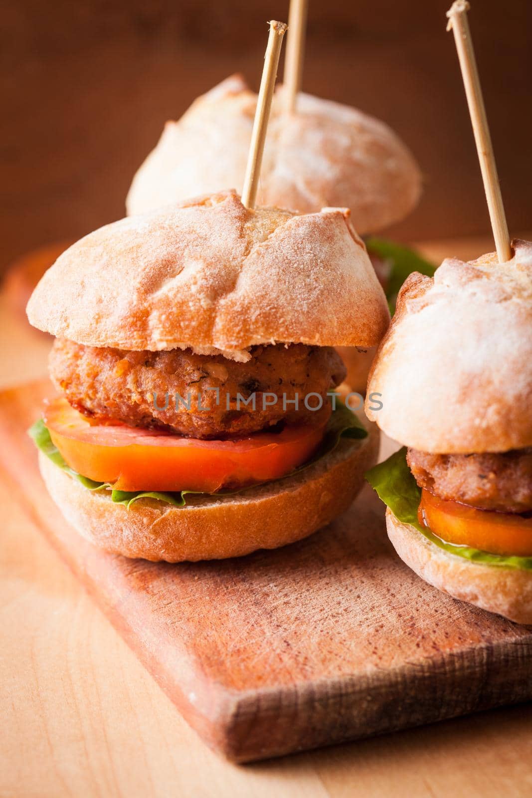 mini burgers with tomato, lettuce and meat cutlet