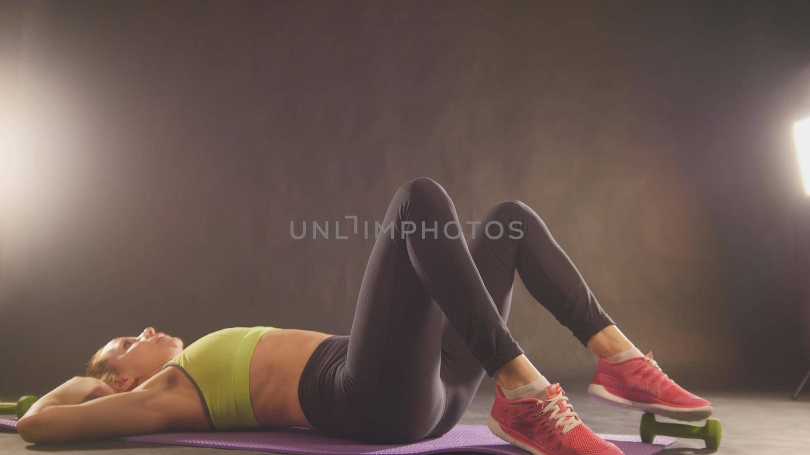 Blonde attractive blonde woman exercising - training for abdominal, close up