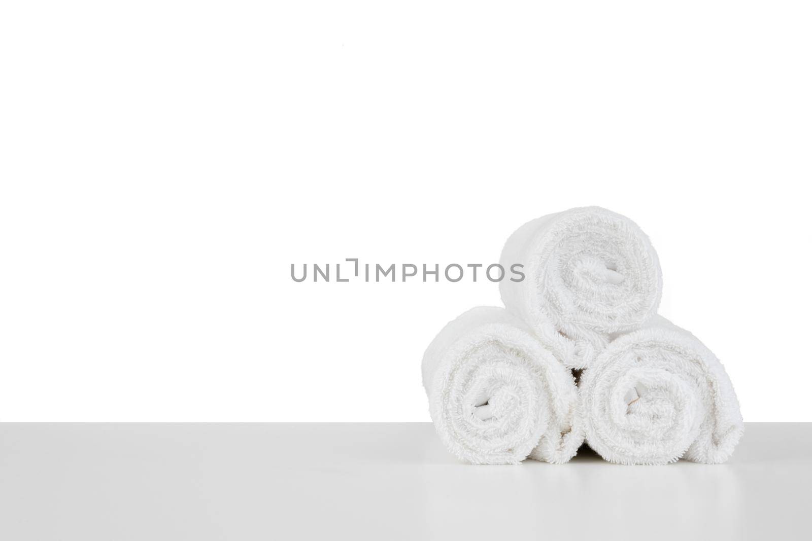 Set of soft spa towels isolated on white by Fabrikasimf