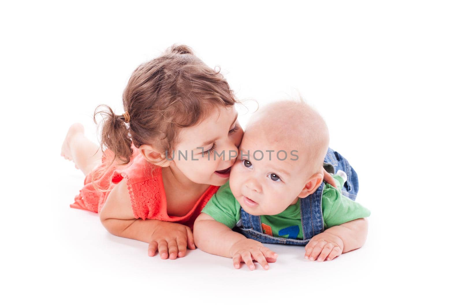 Adorable family. Sister and brother isolated on white