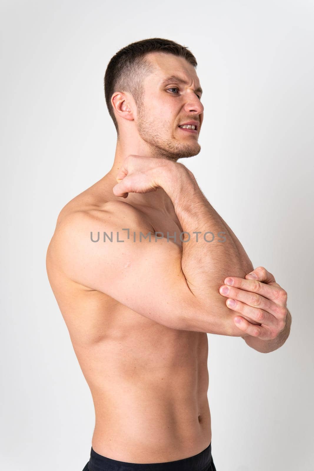 The elbow of the joint muscle in the male white background body muscle, ill man background chronic. Tension lumbar sickness, problem suffer attractive by 89167702191