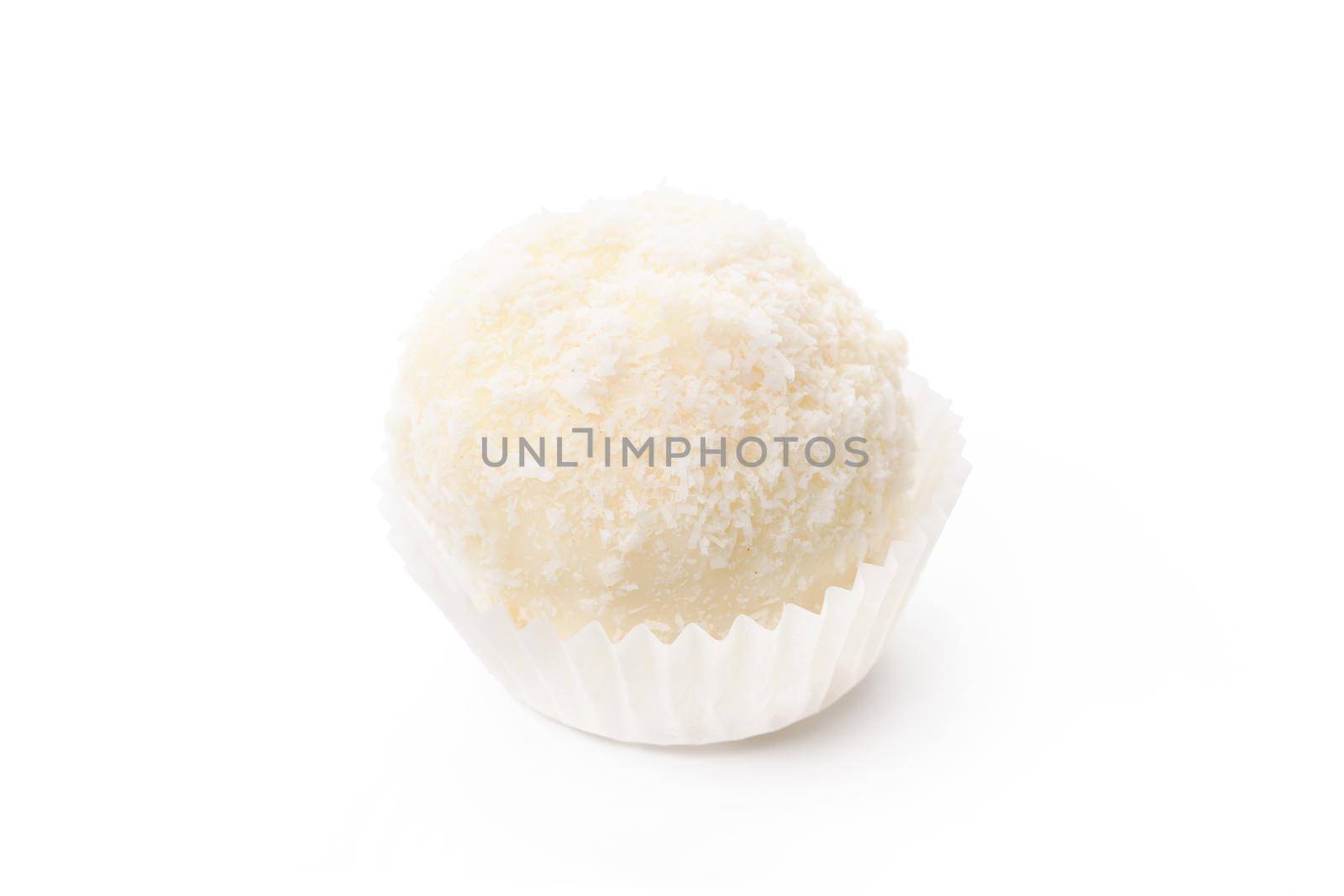 White chocolate candy with coconut topping isolated on white background