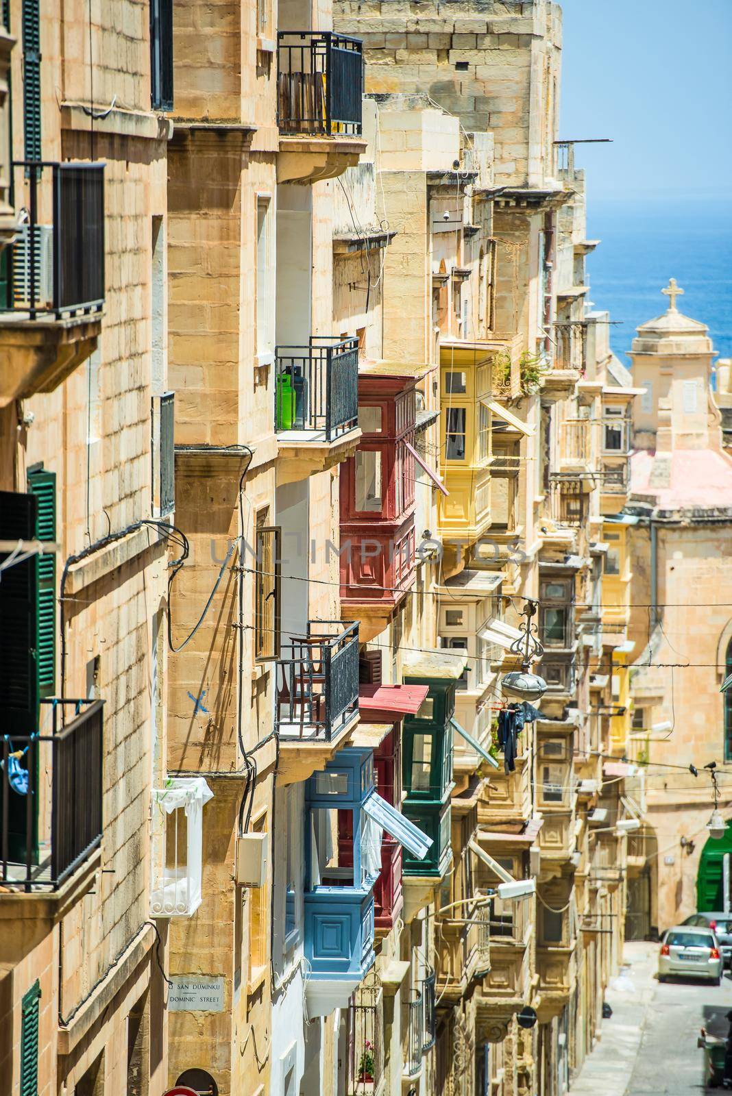 street with colorful balconies in historical part of Valletta in Malta