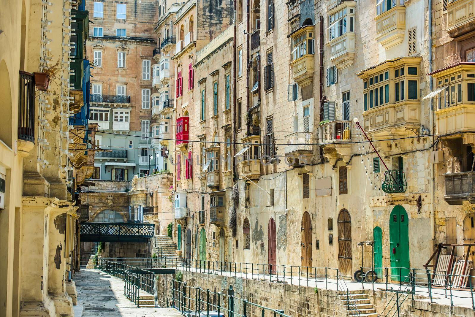street with colorful vintage gates and balconies in Valletta historical center in Malta