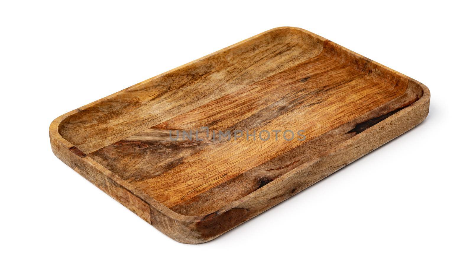 Dark wooden cutting board on white background, close up