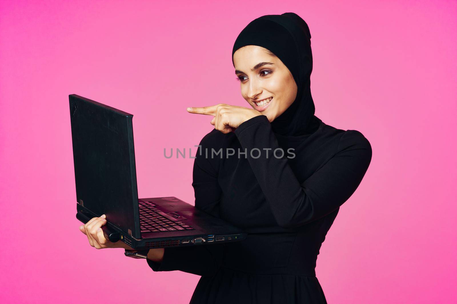 cheerful muslim woman with laptop education student internet technology by Vichizh