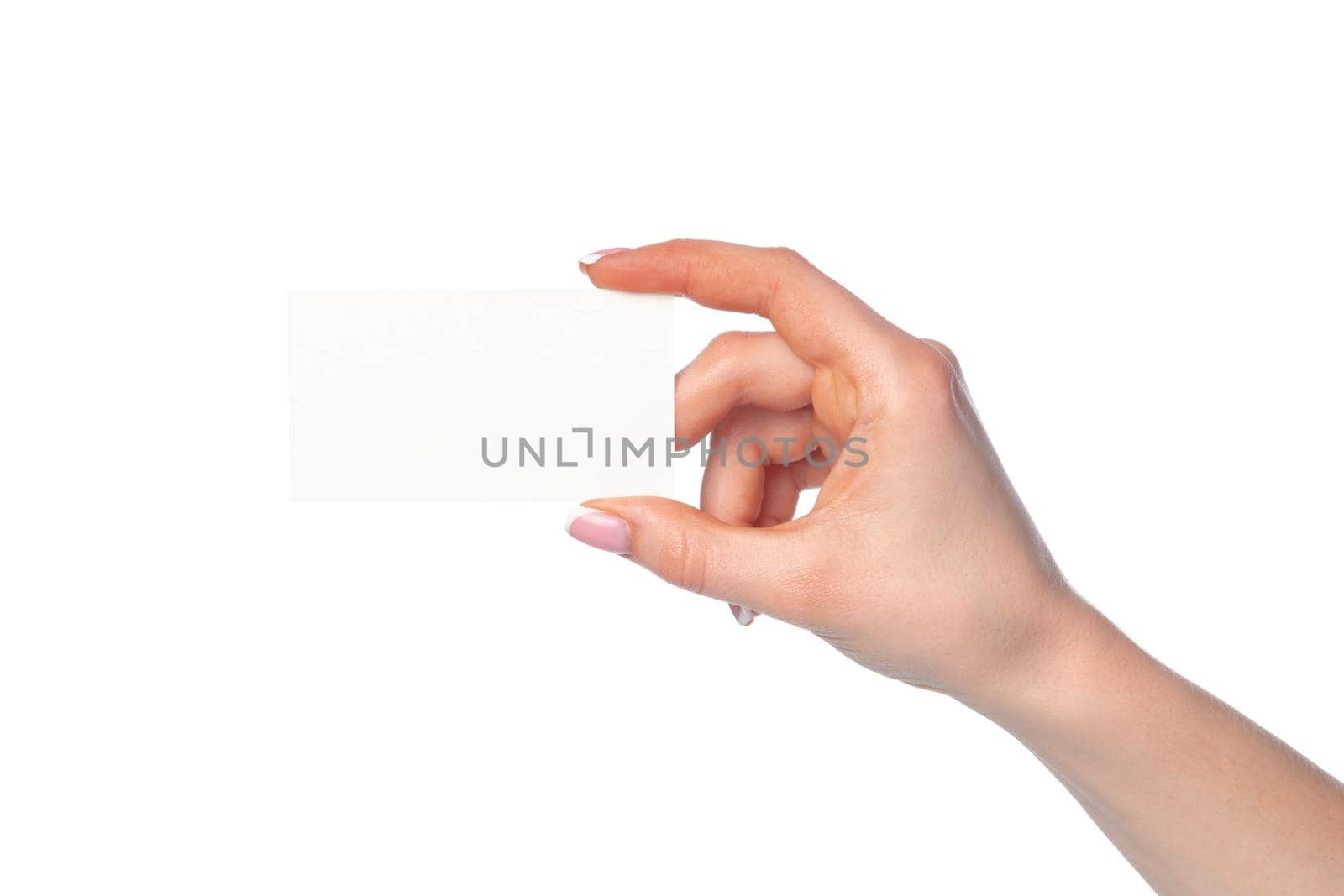 Beautiful female hand holding white business card on white background by Fabrikasimf