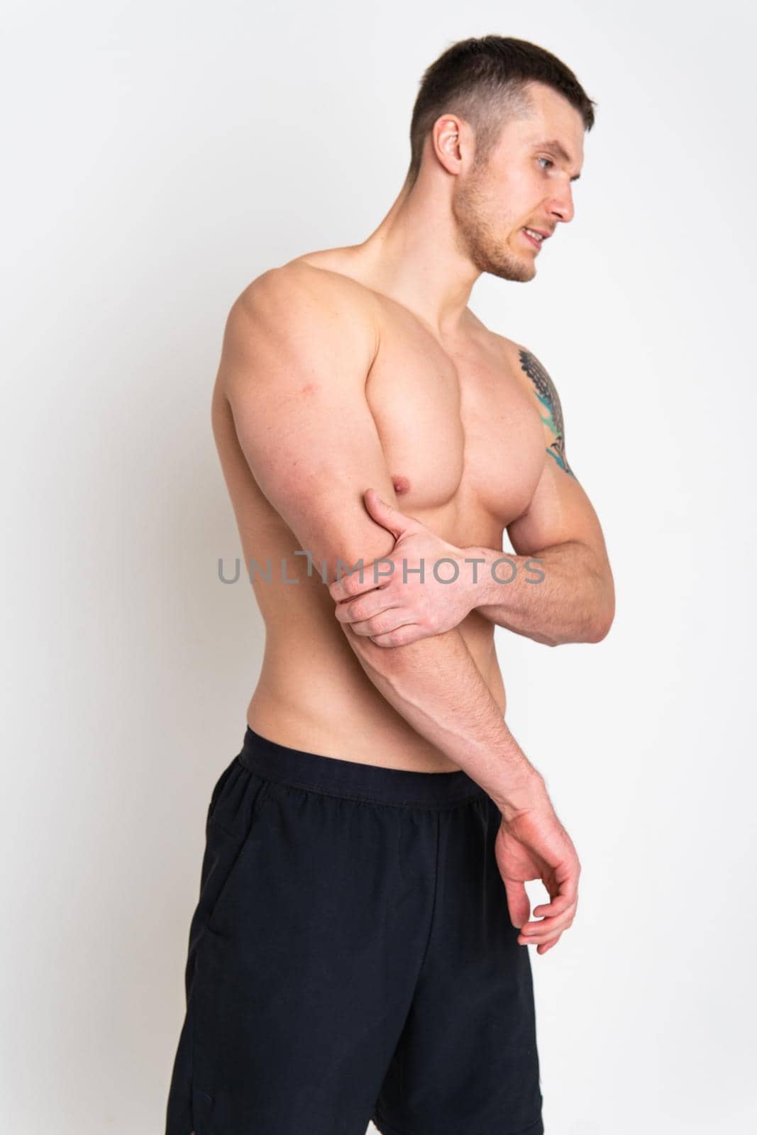 The elbow of the joint muscle in the male white background back hurt muscle, spine man massage medical, muscular Hold red care, lower suffer attractive by 89167702191