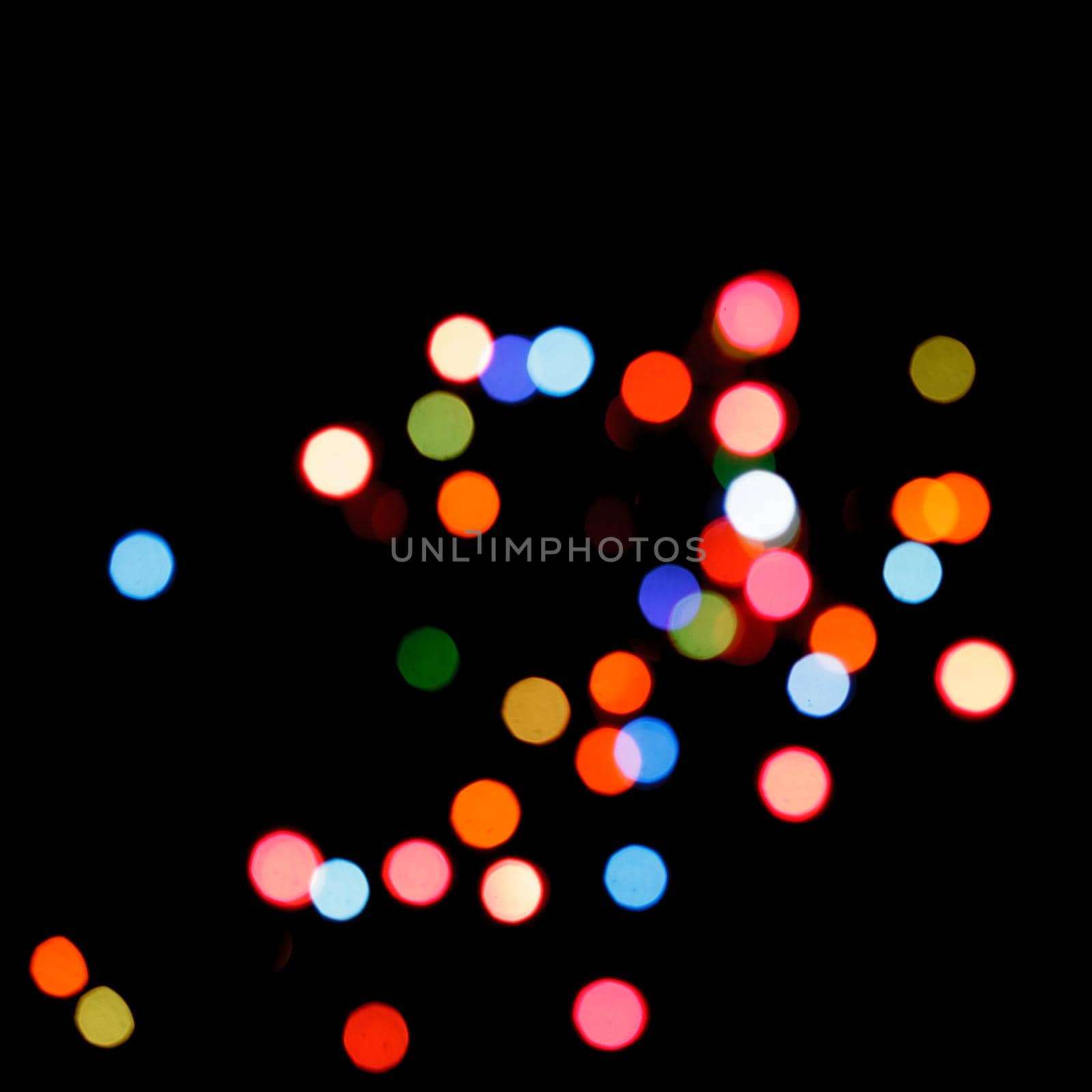 Blurred colorful lights on a black background