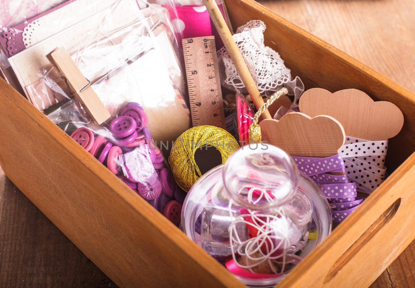 Scrapbooking craft materials in a wooden box