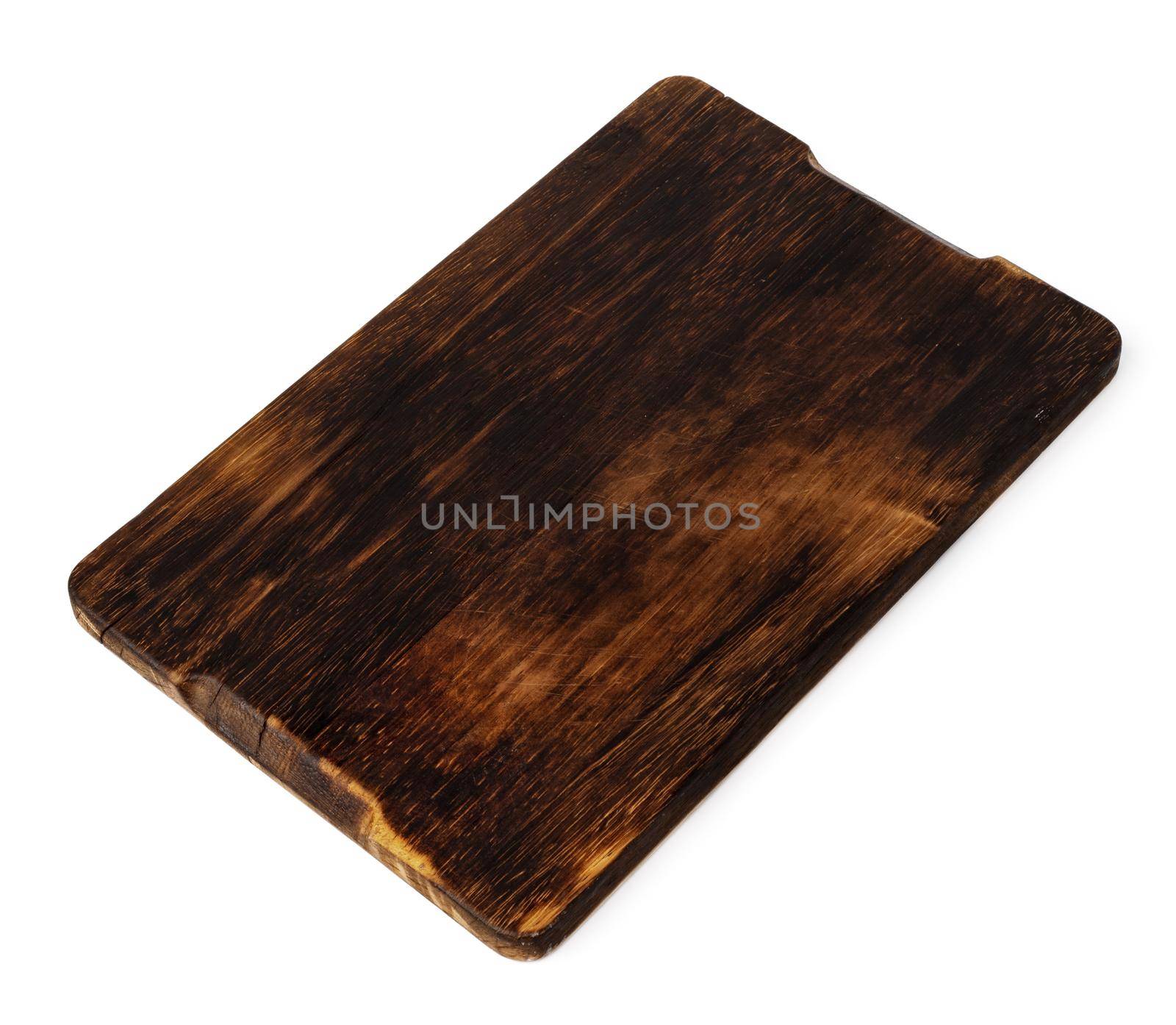 Dark wooden cutting board on white background by Fabrikasimf
