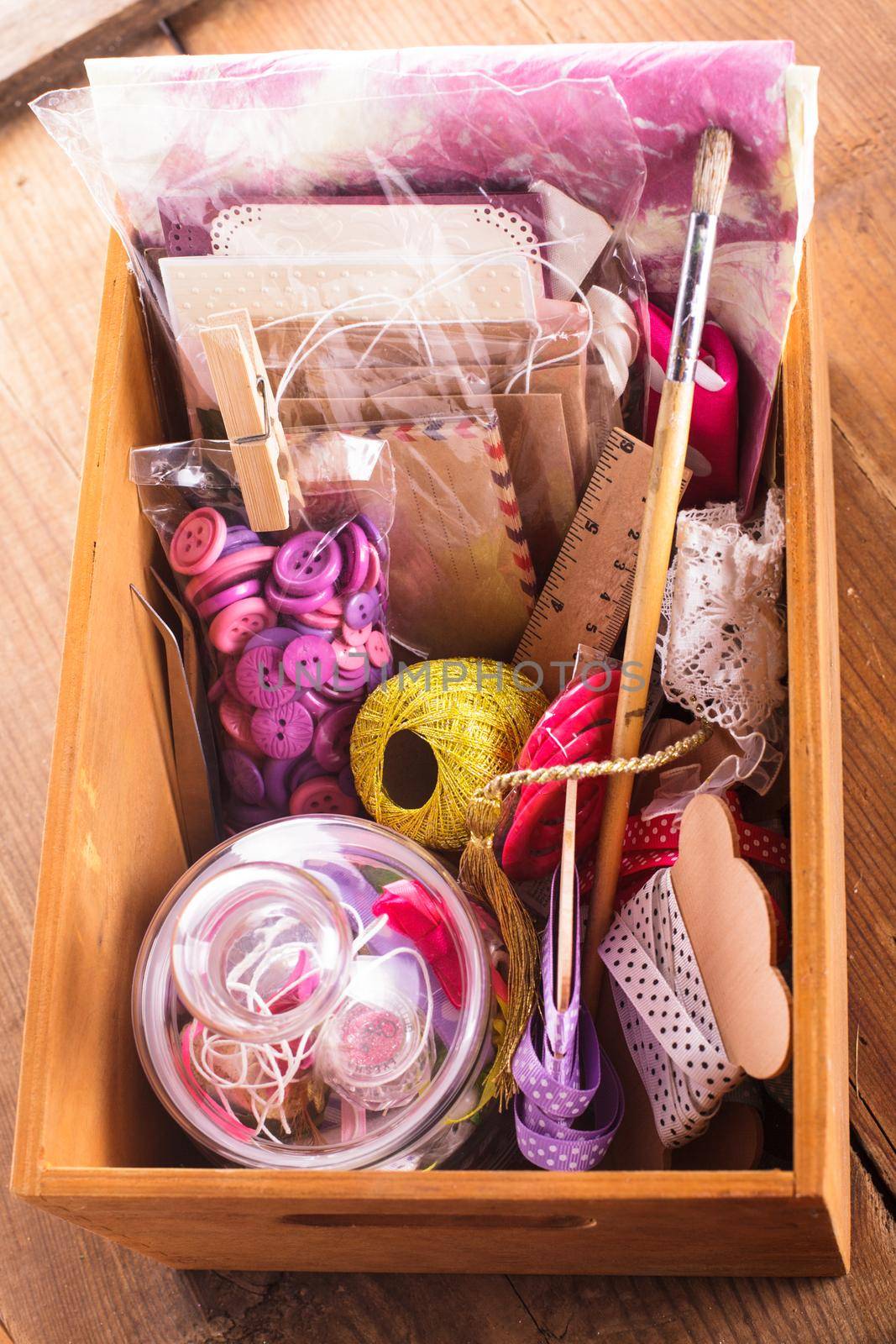 Scrapbooking craft materials in a wooden box