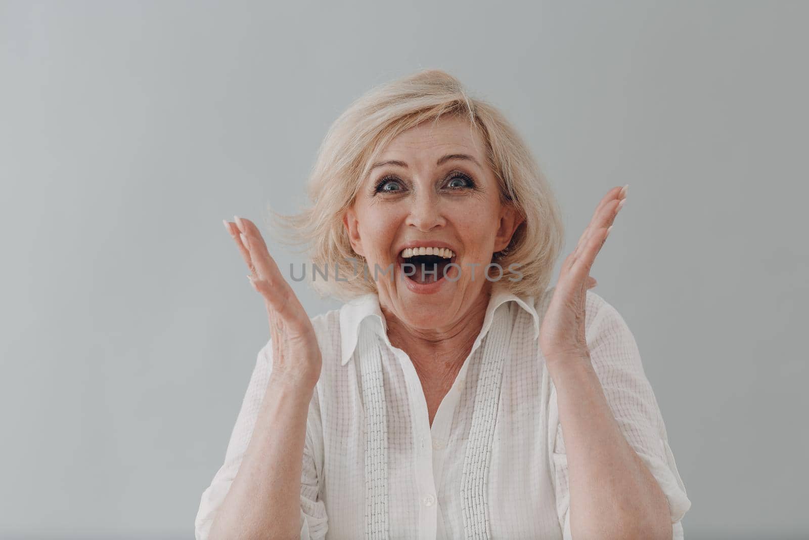 Concept affordable dentures implants. Elderly caucasian old aged woman portrait gray haired smiling portrait
