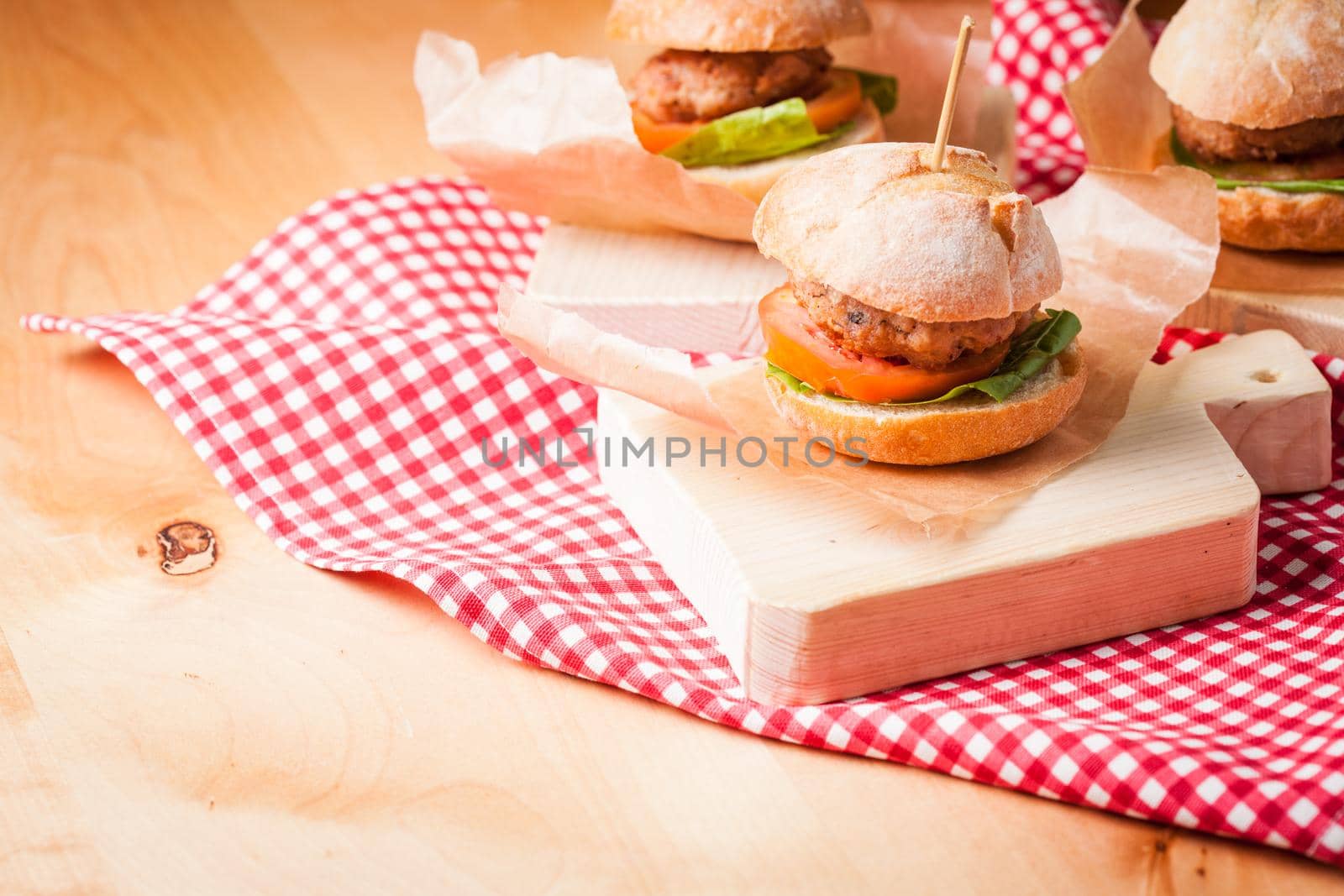 mini burgers with tomato, lettuce and meat cutlet