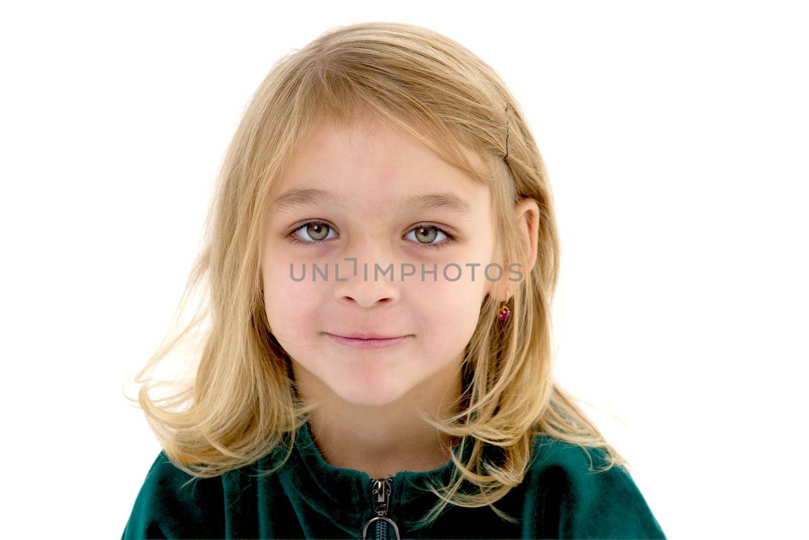 Close-up face of a beautiful little girl. The concept of a happy childhood emotions.