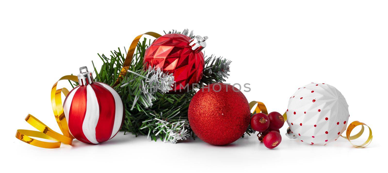 Christmas tree branch with Christmas baubles isolated on white background, copy space