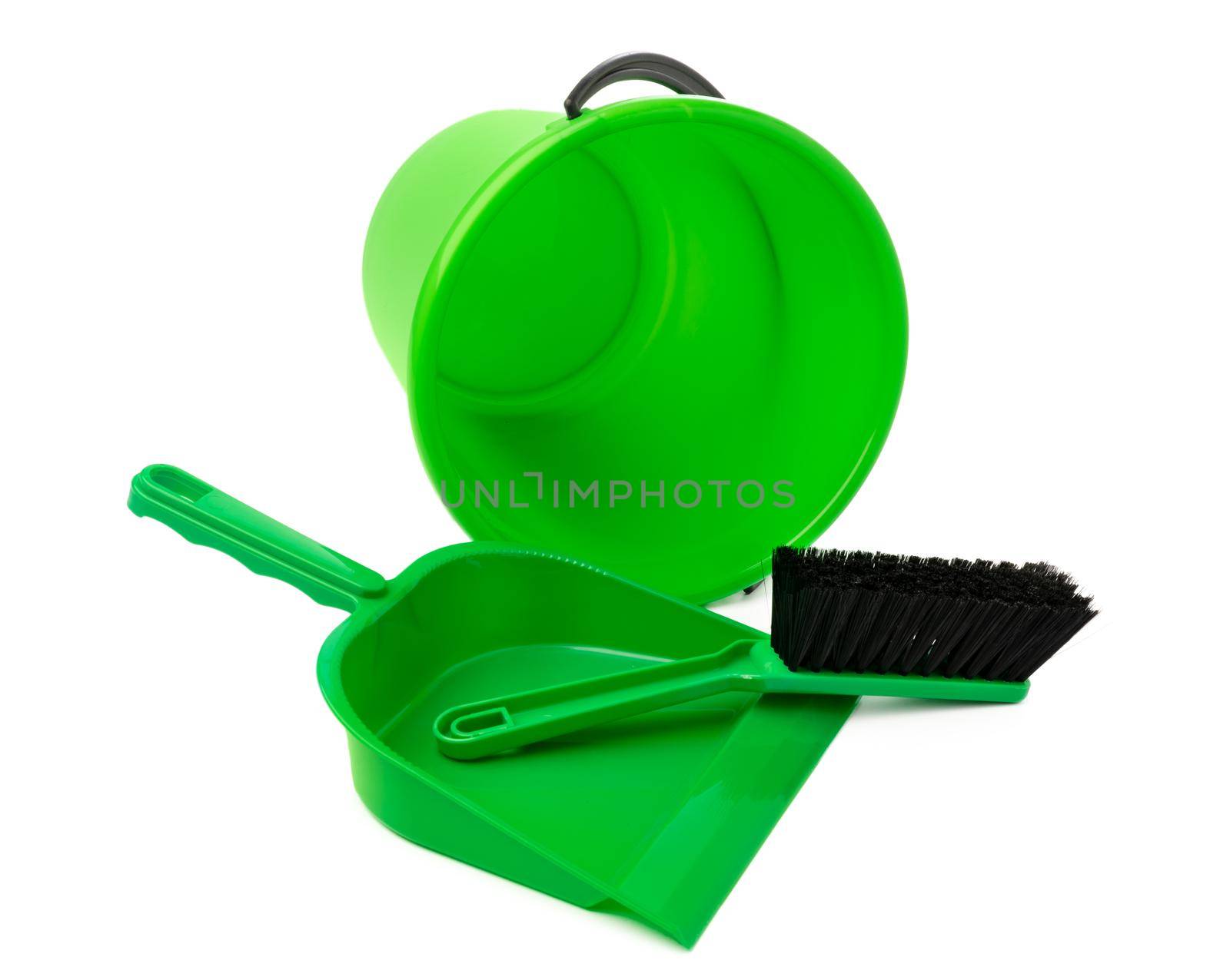 Green plastic bucket and a scoop isolated on white background, close up