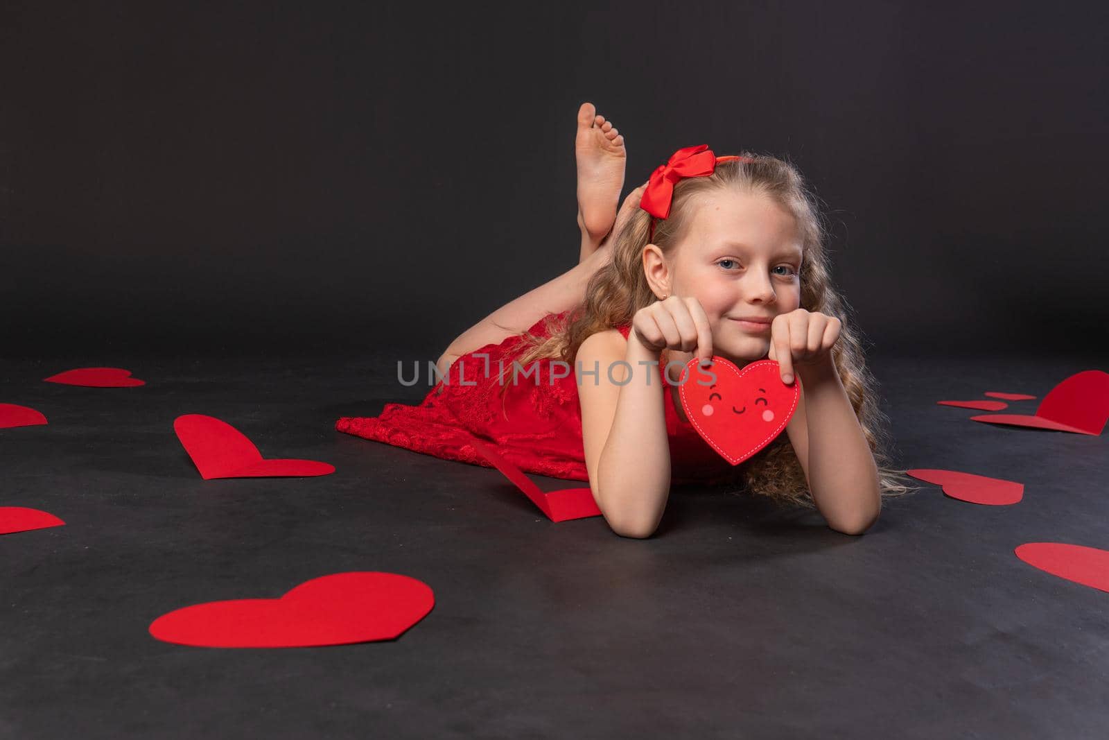 on the elbows paper hearts valentine valentine background, valentine's day, on the floor hearts romance space. banner. event formula of love, frame in red dress girl, barefoot by 89167702191