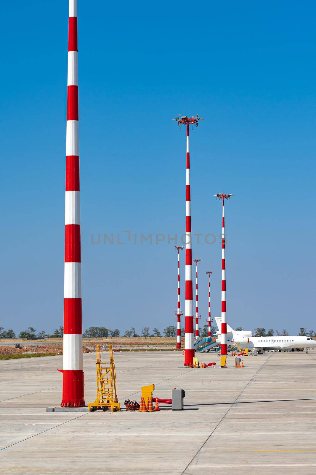 Airport pillar of red and white color on airfield