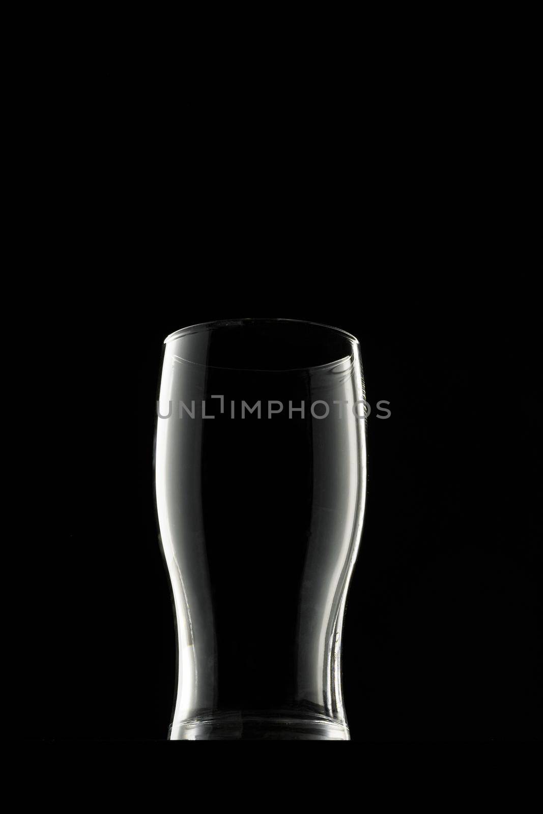 Empty glass on black background