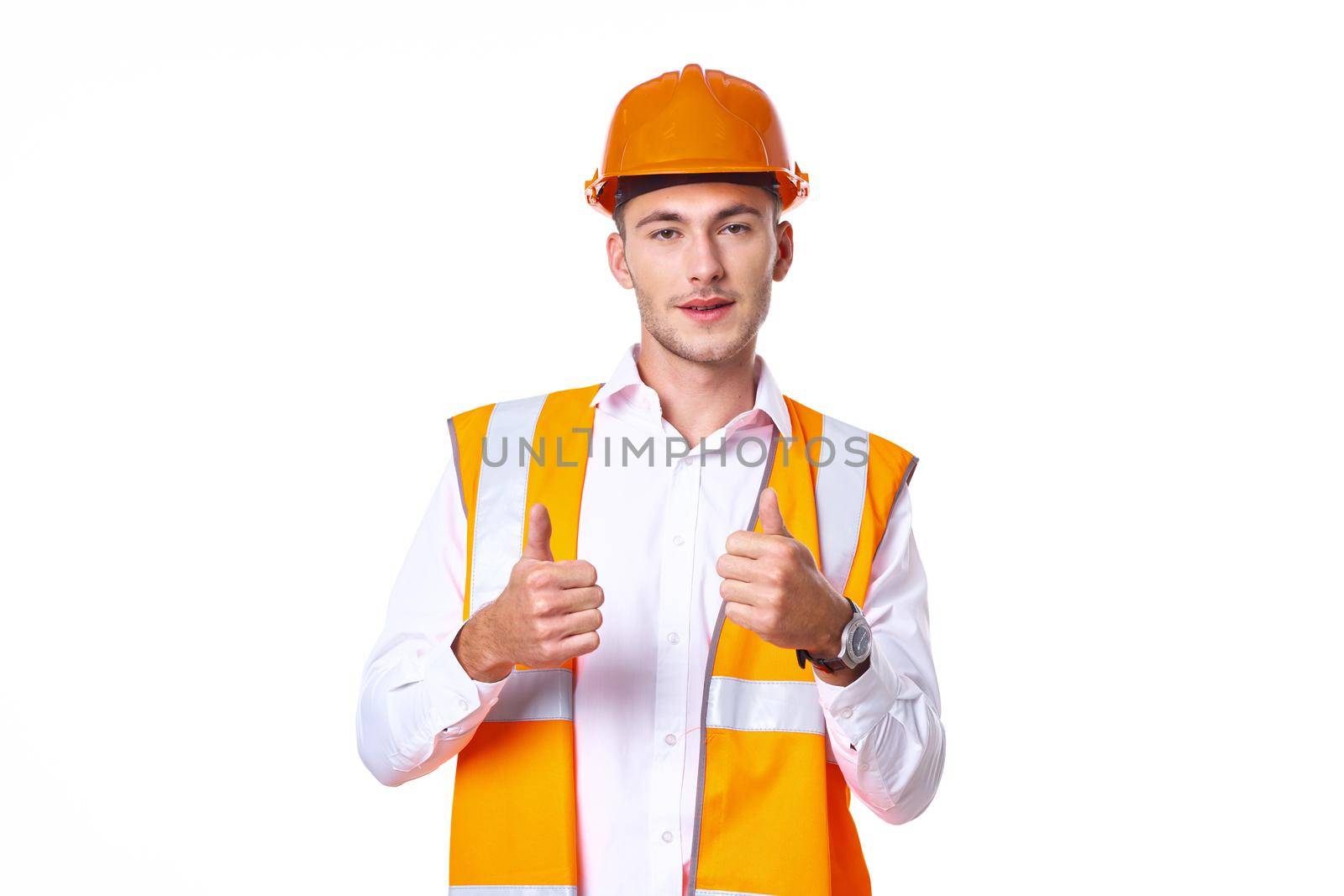 working man in orange uniform posing construction. High quality photo