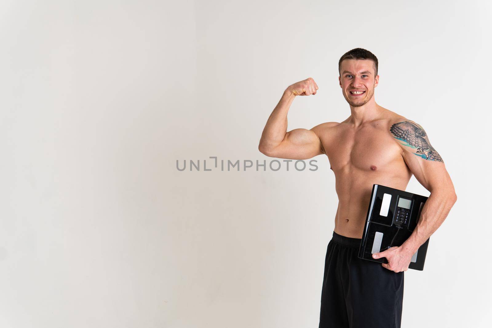 Man with weights health pondered, health and sports on a white background ache spine background expression. lumbar therapy, ain suffer attractive