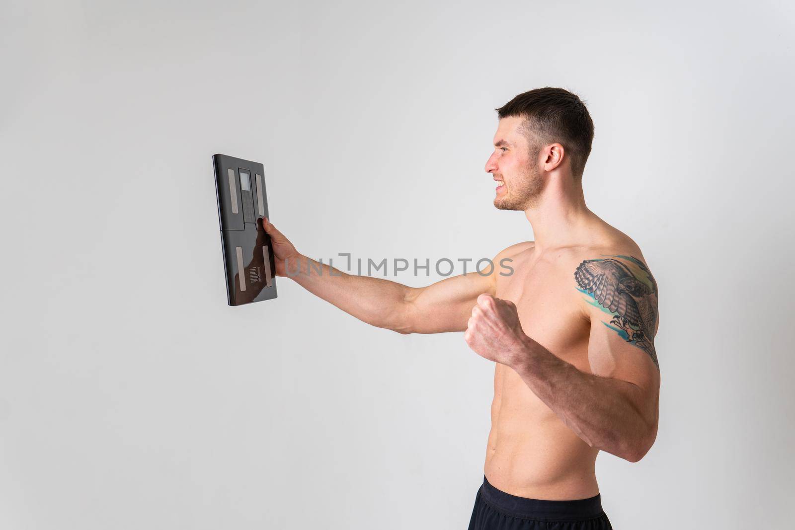 Man with weights health pondered, health and sports on a white background painful, man adult, hand chronic. lumbar therapy, problem suffer attractive