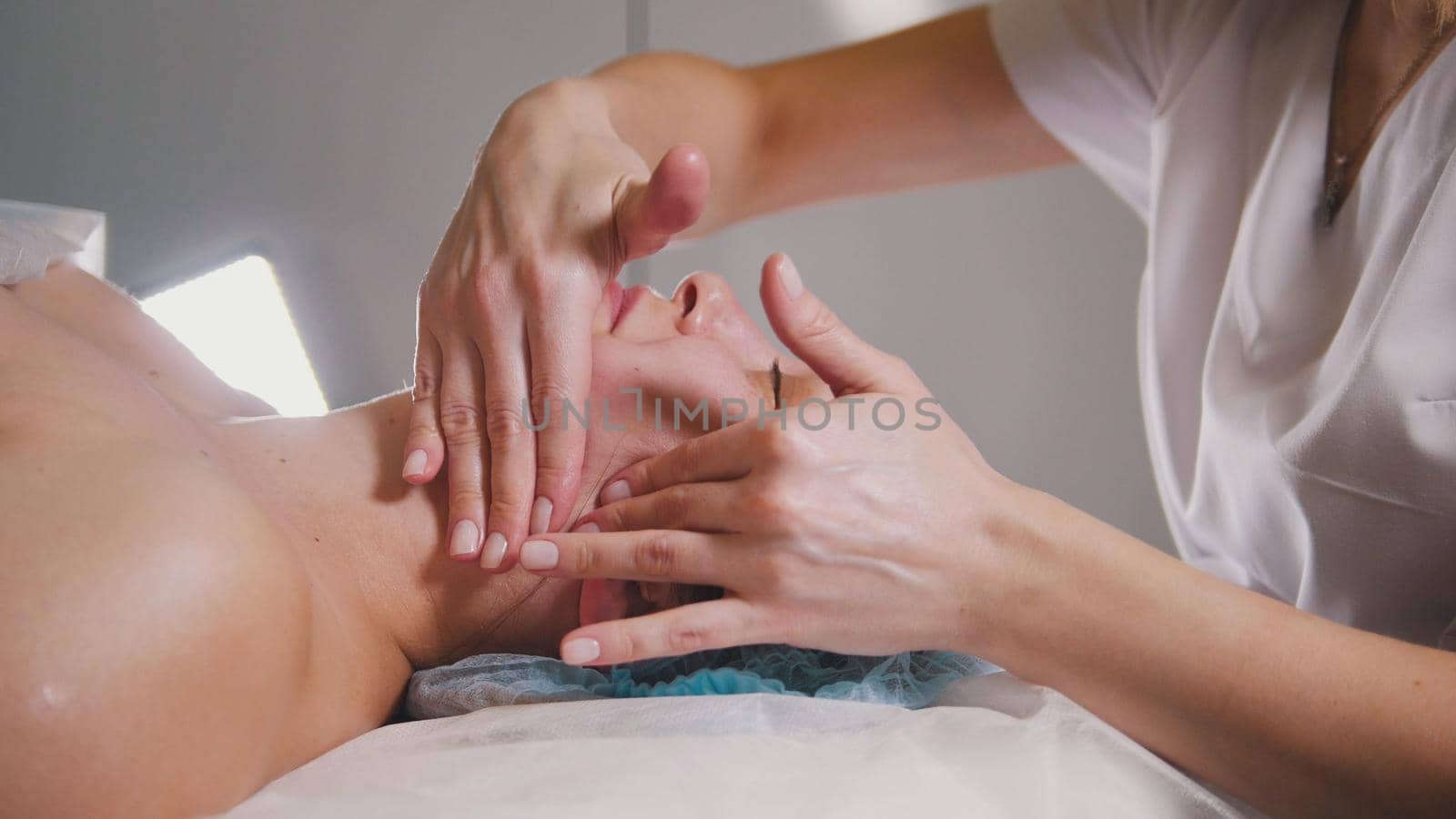 Massage for face skin - spa salon skincare, close up
