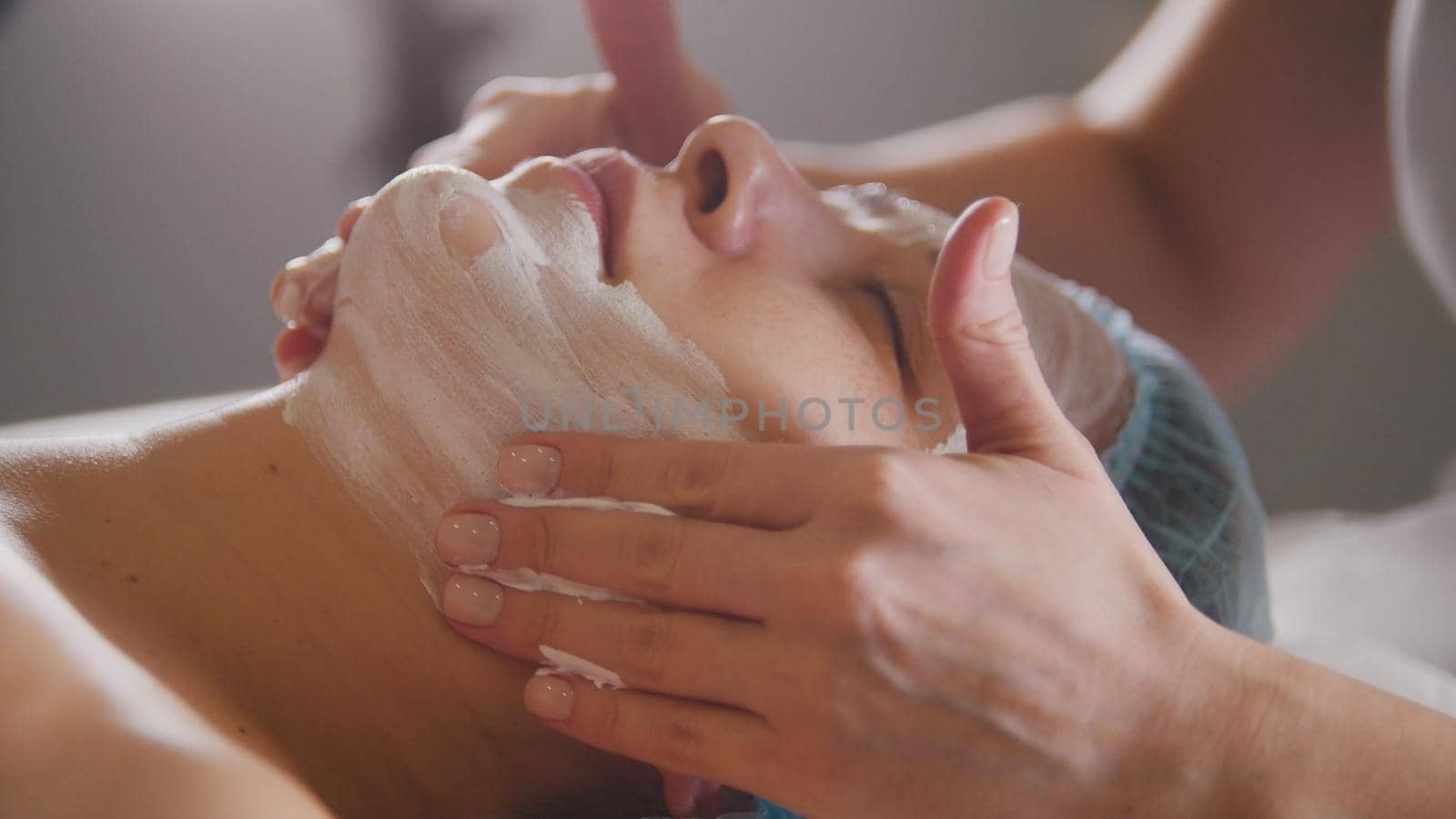 Massage for face skin - spa salon skincare, close up