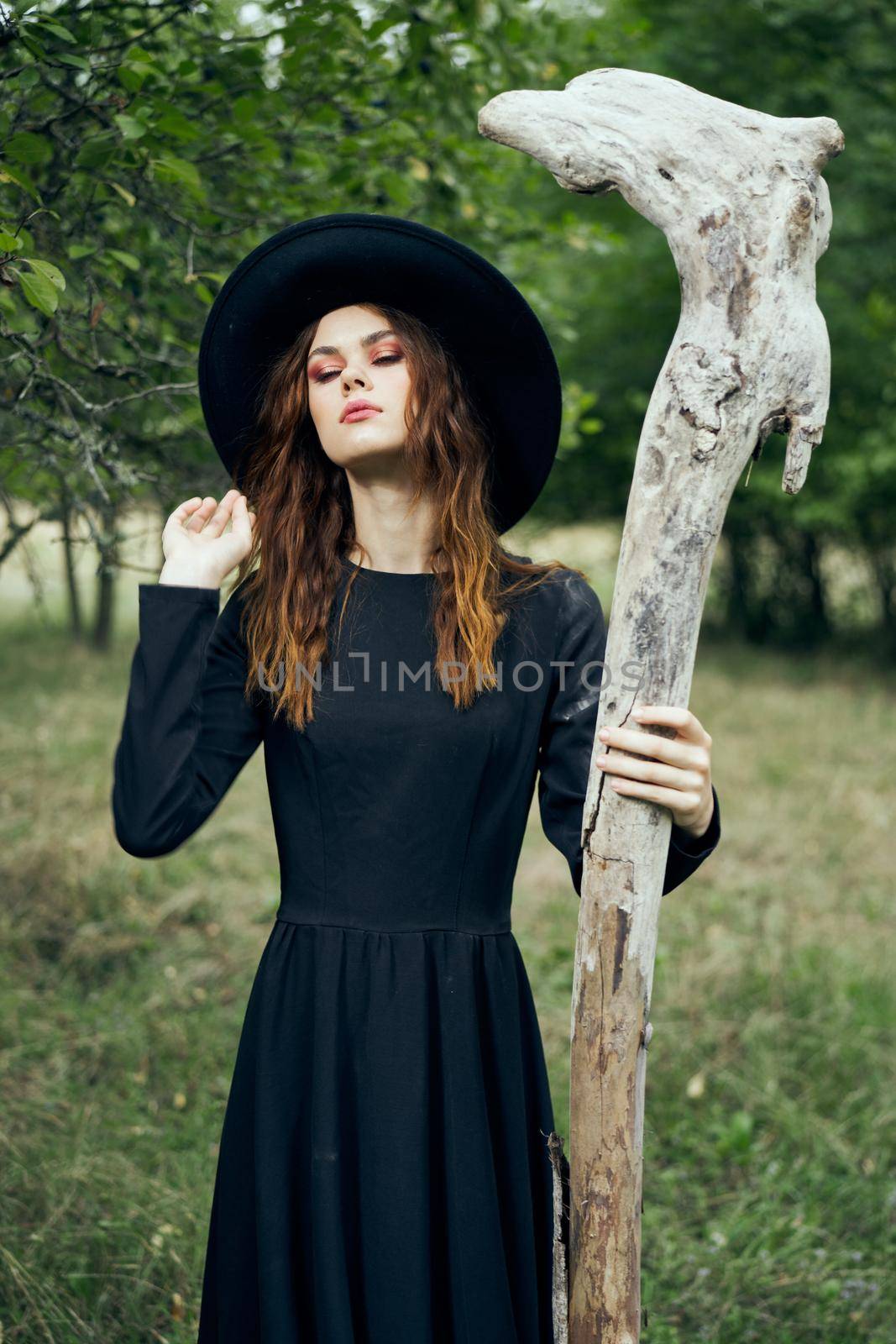 woman in witch costume fantasy magic forest posing by Vichizh