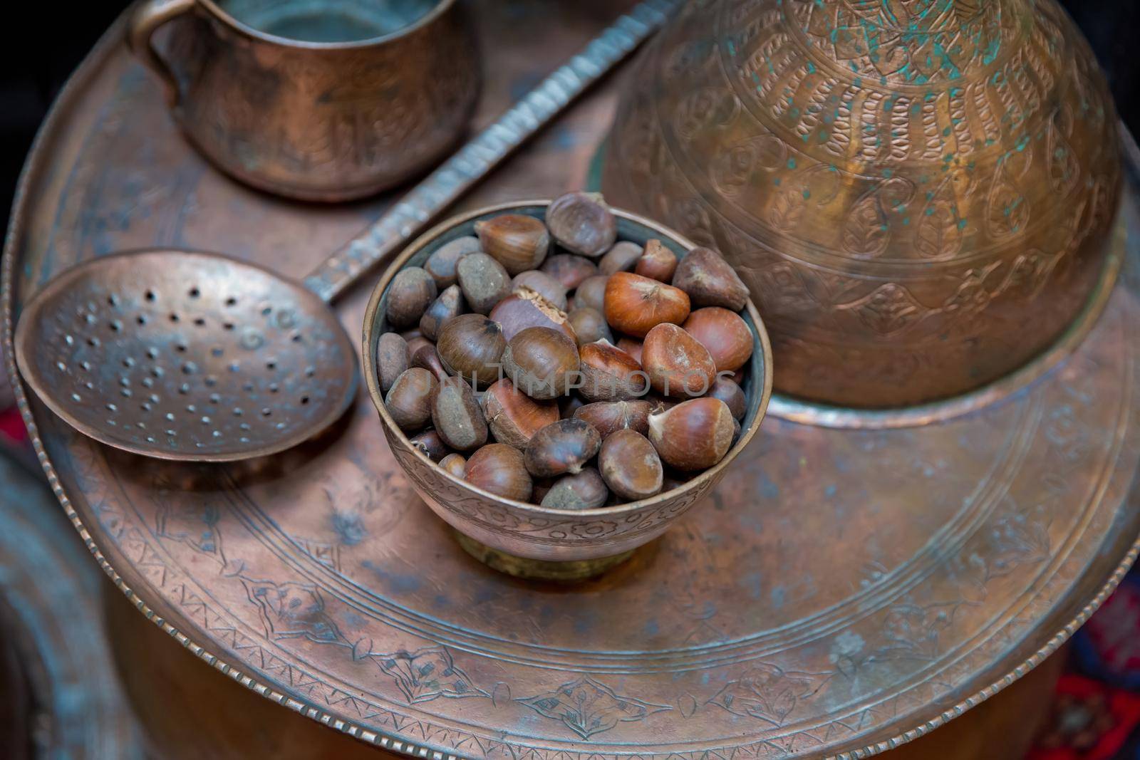 Ancient vintage Copper bowl . Copper containers. Spoonful of copper. Chestnut. by Adil_Celebiyev_Stok_Photo