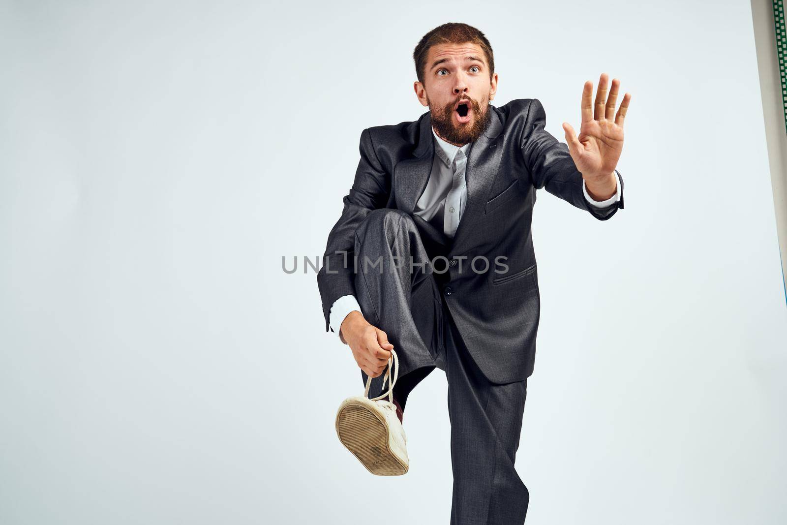 business man in suit motion emotions studio. High quality photo