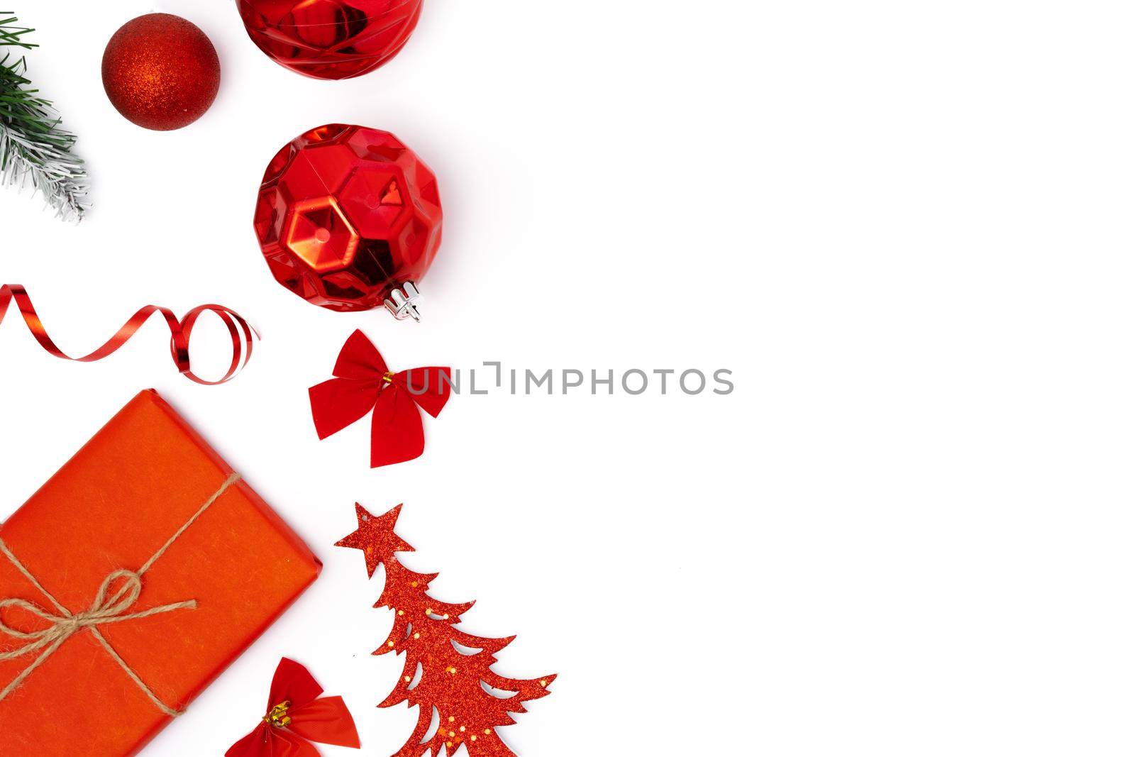 Top view of Christmas decorations composition on white background with copy space