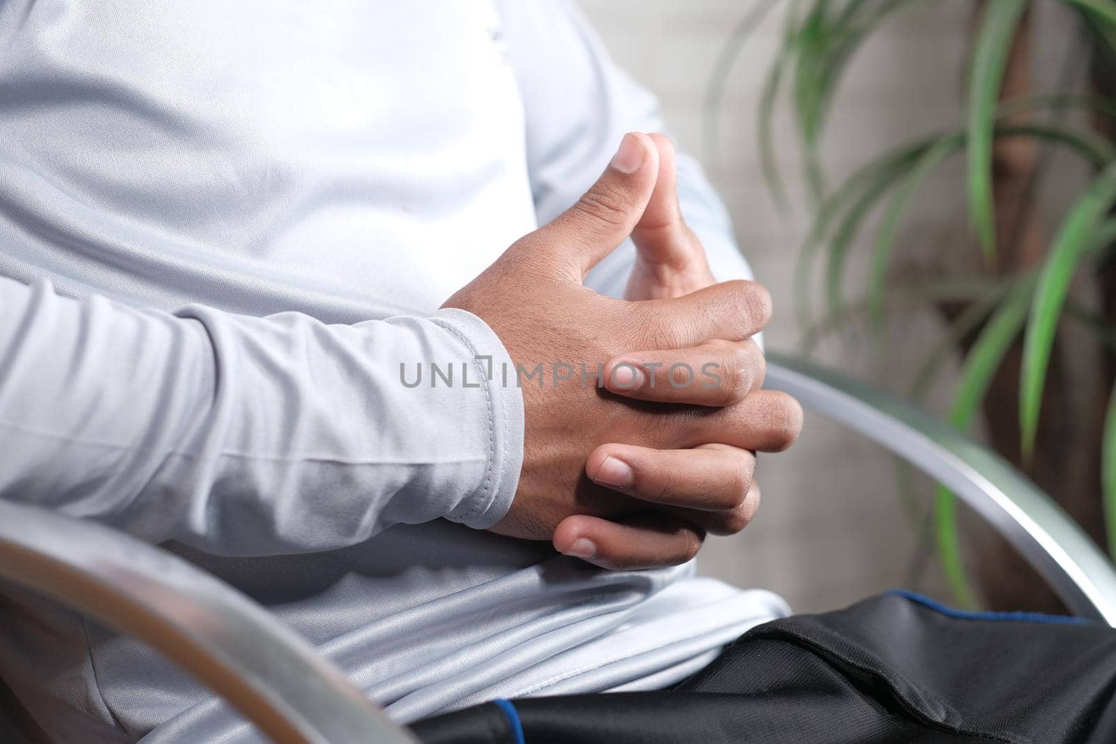 a nervous young man hand .