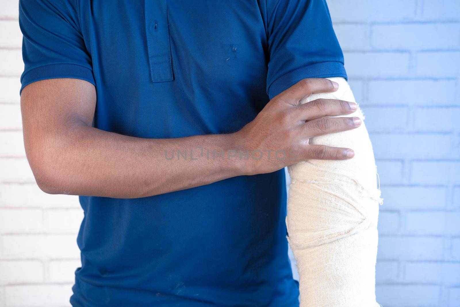 injured painful hand with bandage ,