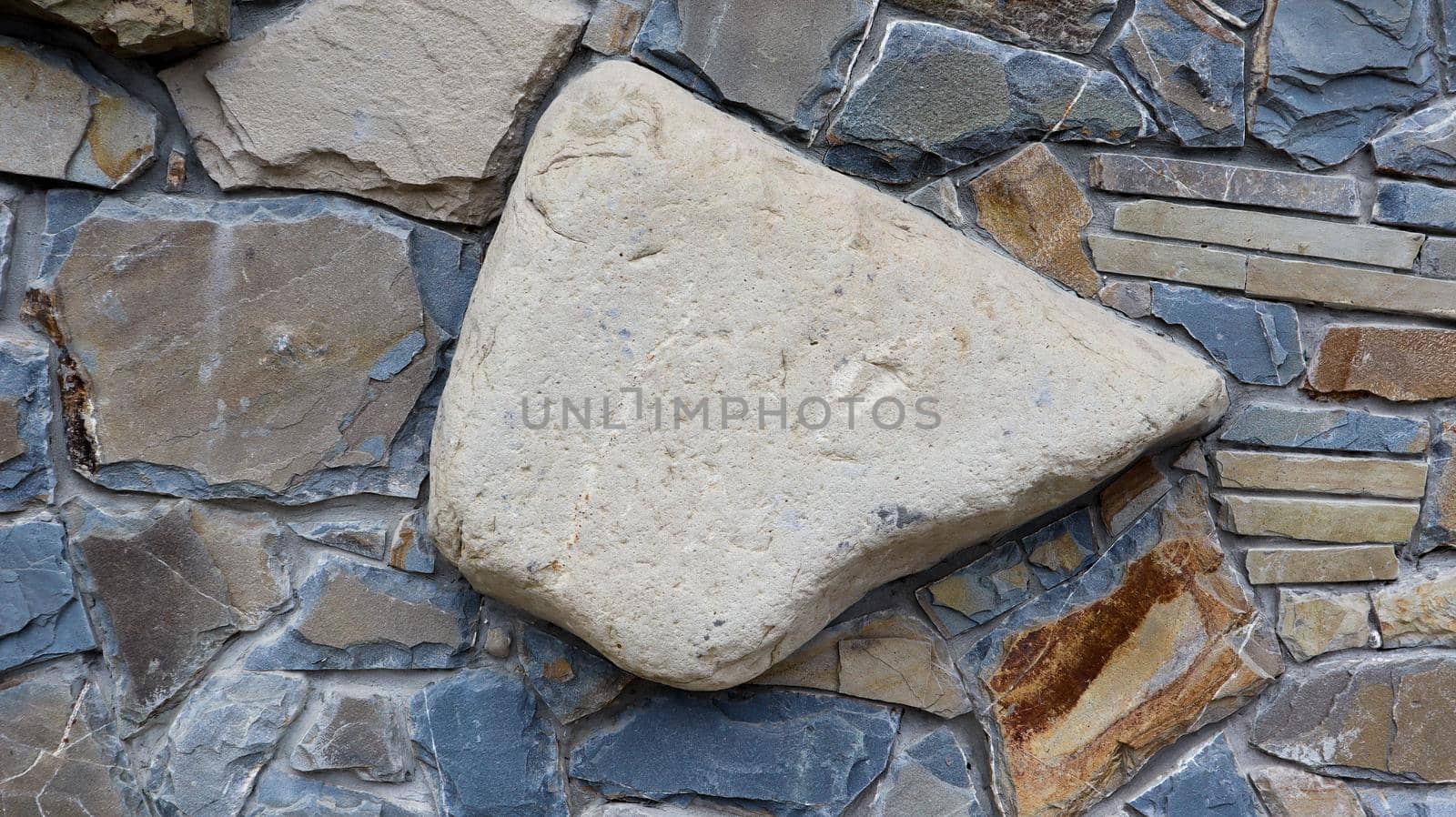 The texture of the stone wall. Old castle stone wall texture background. Stone wall as a background or texture. Part of a stone wall, for background or texture. pattern gray color modern style design.