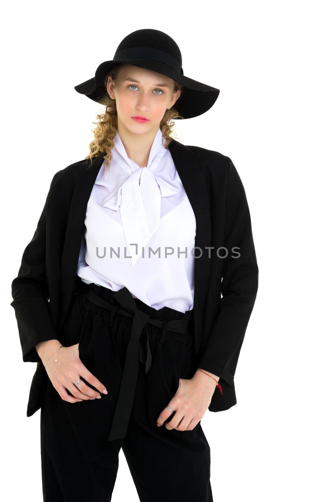 Portrait of young woman in office suit and hat by kolesnikov_studio