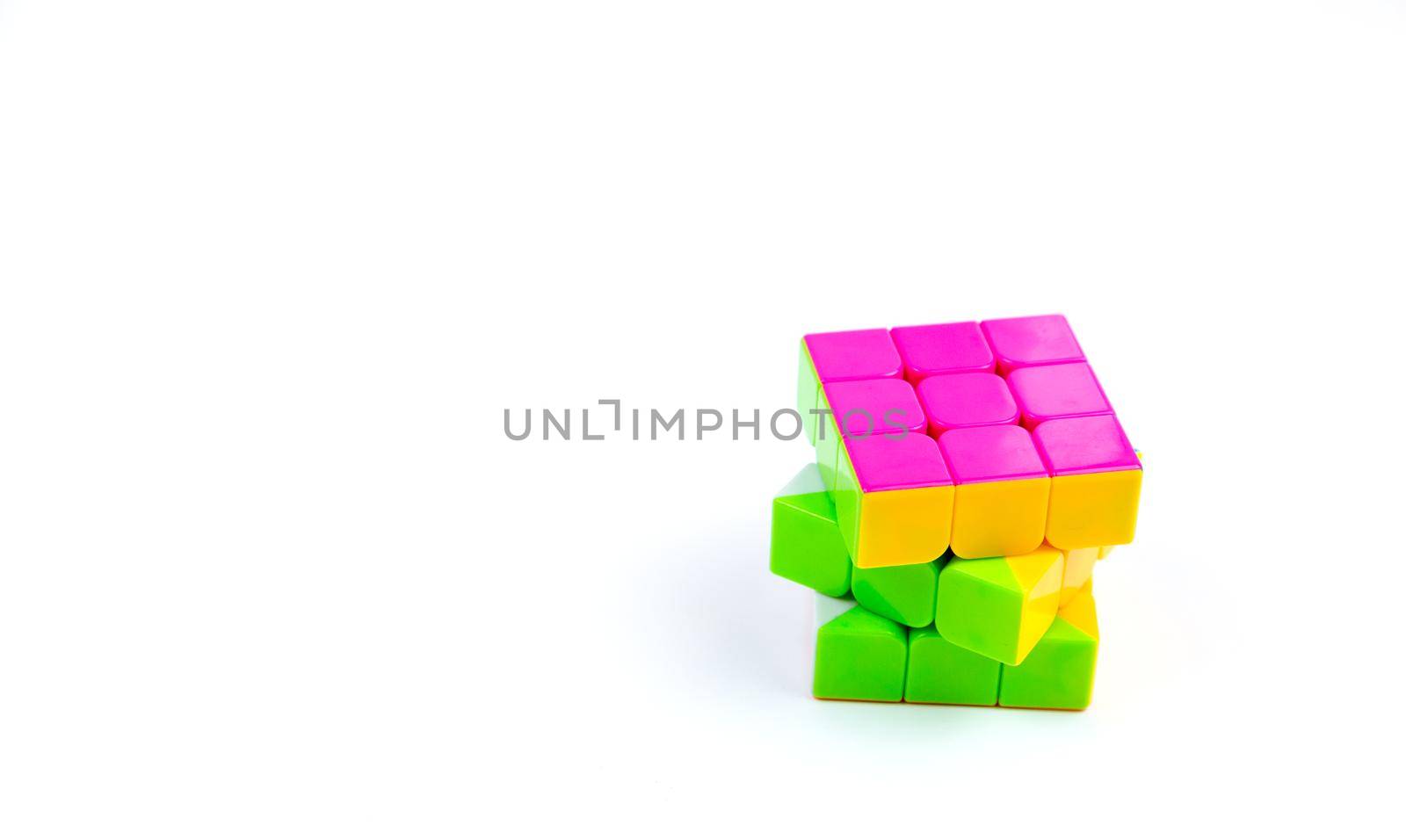 Game multi-colored cube on a white background. Game concept with copy space for text.