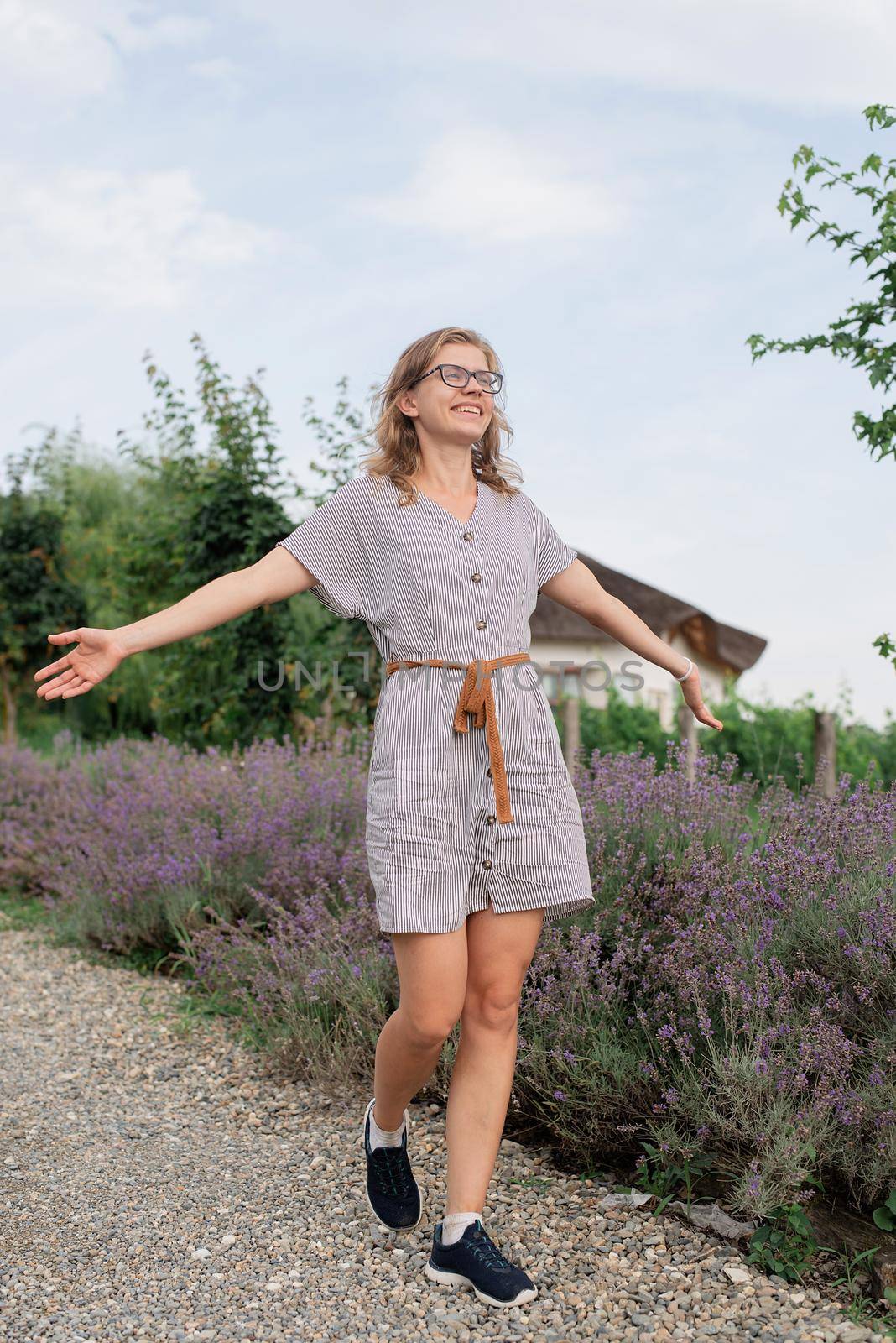 Woman walking by the lavender field