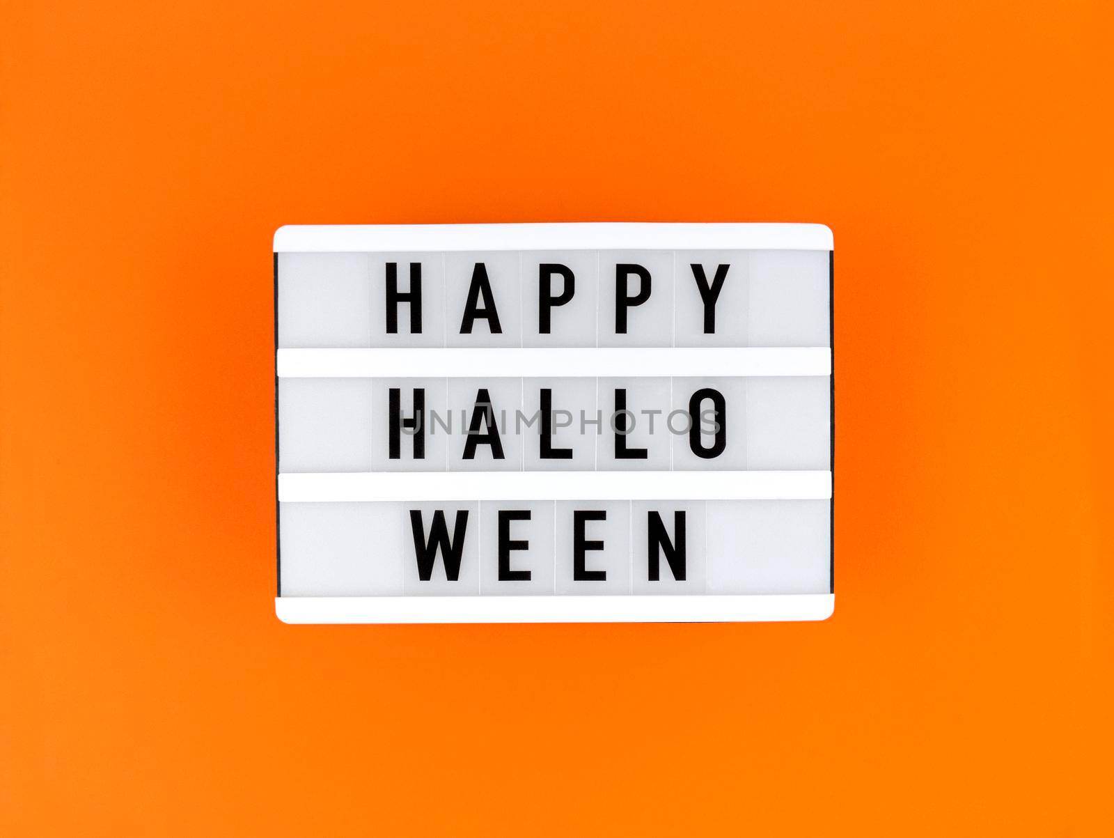 Light box with Happy Halloween on an orange background. by anna_artist