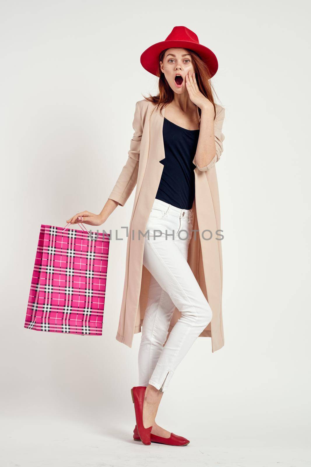 pretty woman with packages in hands Shopaholic studio model. High quality photo