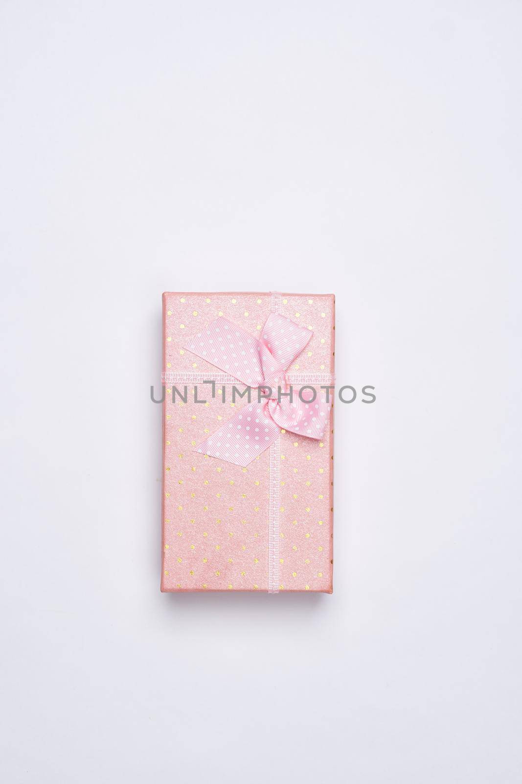 gift pink box with flowers holiday top view light background. High quality photo